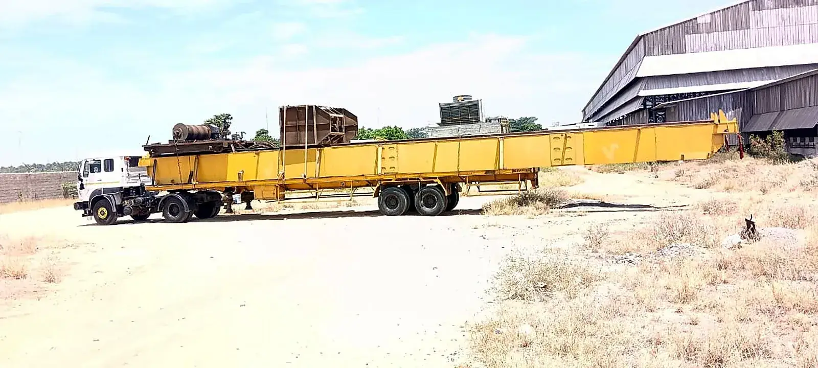 Wind Turbine Blade Transport: Extra-long yellow girder load on an extendable trailer